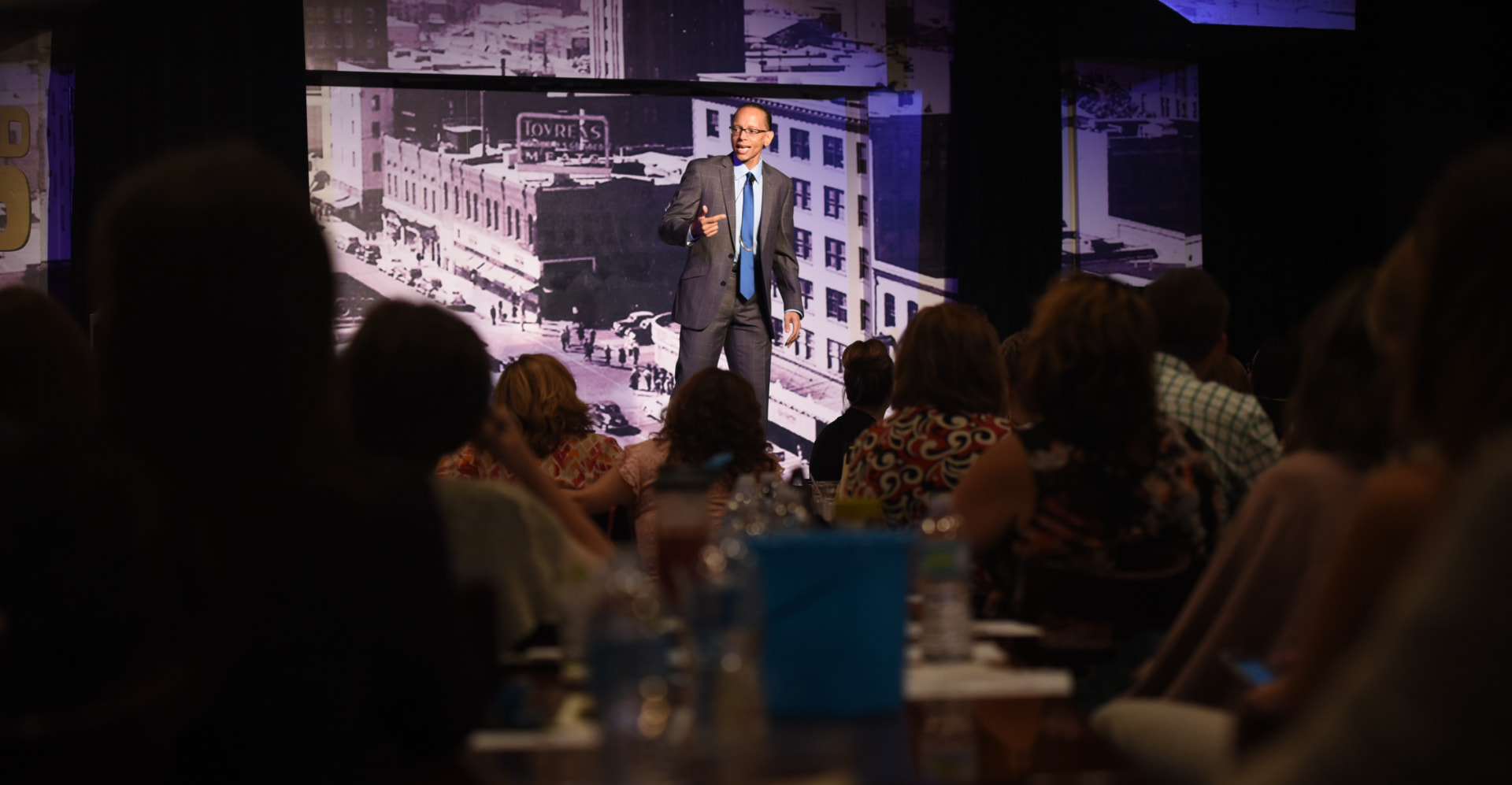 Dr. Tyrone A. Holmes delivering a keynote on stage